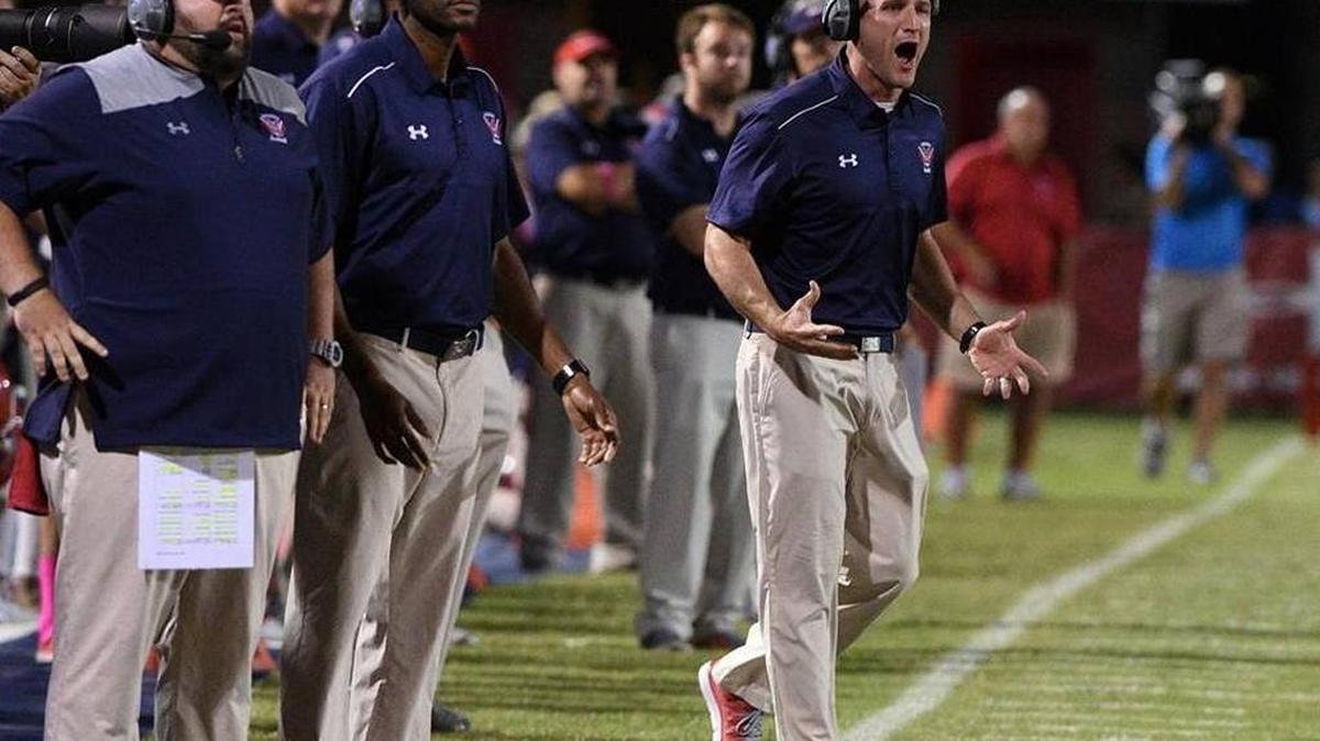 Manatee head coach John Booth yells from the sidelines at a game on Joe Kinnan Field at Hawkins Stadium.