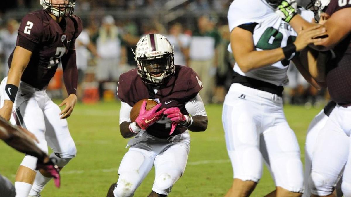 Braden River's Raymond Thomas slips through Venice's defense during last October’s district showdown.