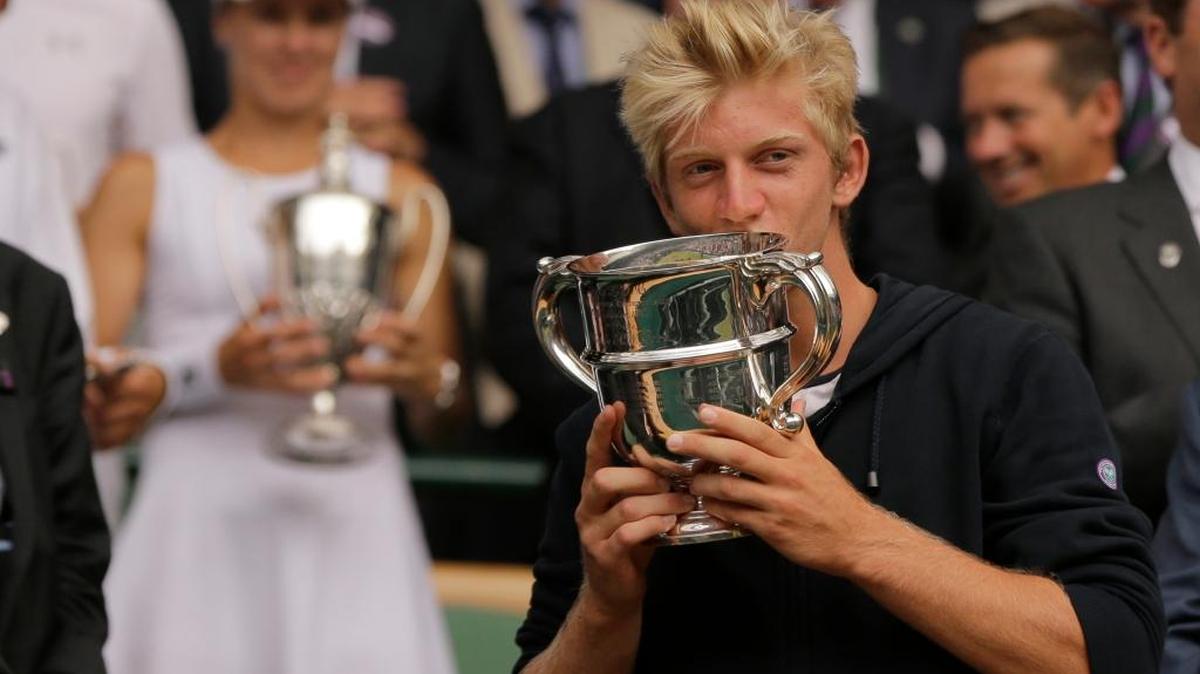 Spain’s Alejandro Davidovich Fokina kisses the trophy after defeating Argentina’s Axel Geller in the Boys’ Singles final the Wimbledon Tennis Championships in London.