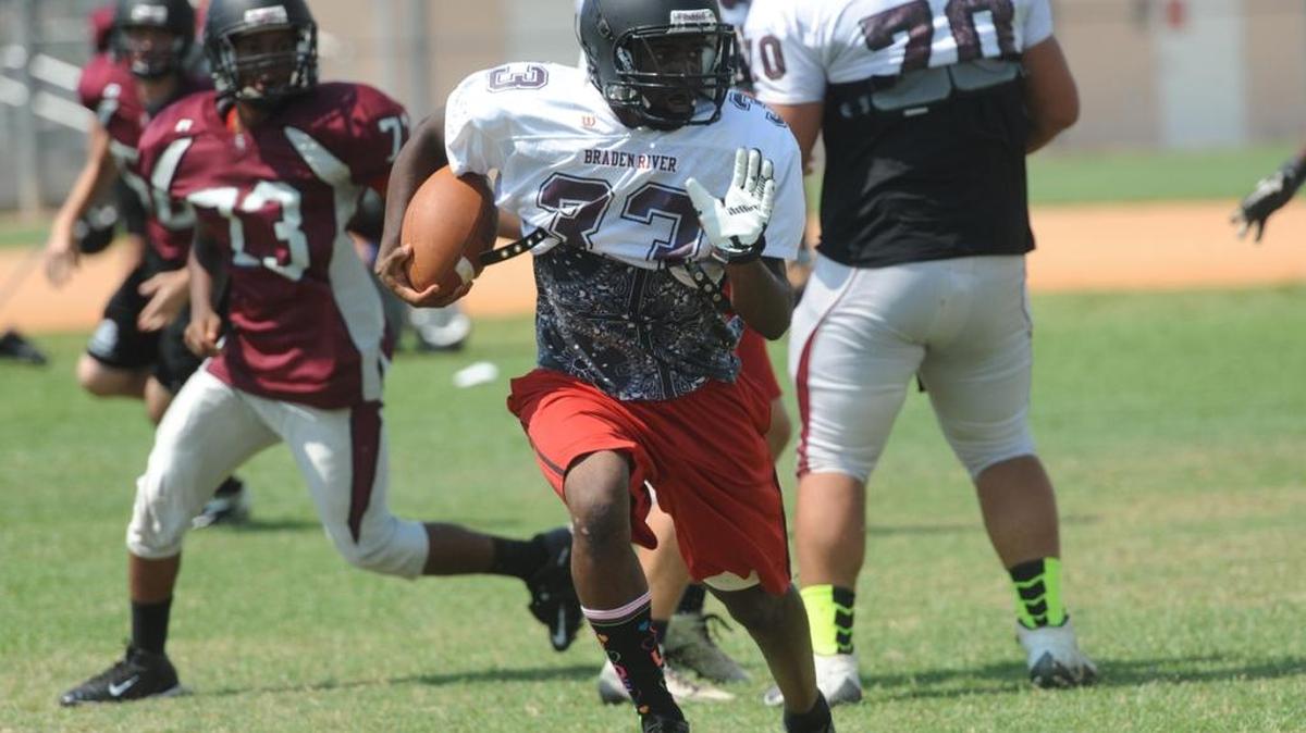 Braden River High running back Jaylin Austin runs a play during practice in May 2015. High school teams begin practice for the 2016 campaign in less than a week.