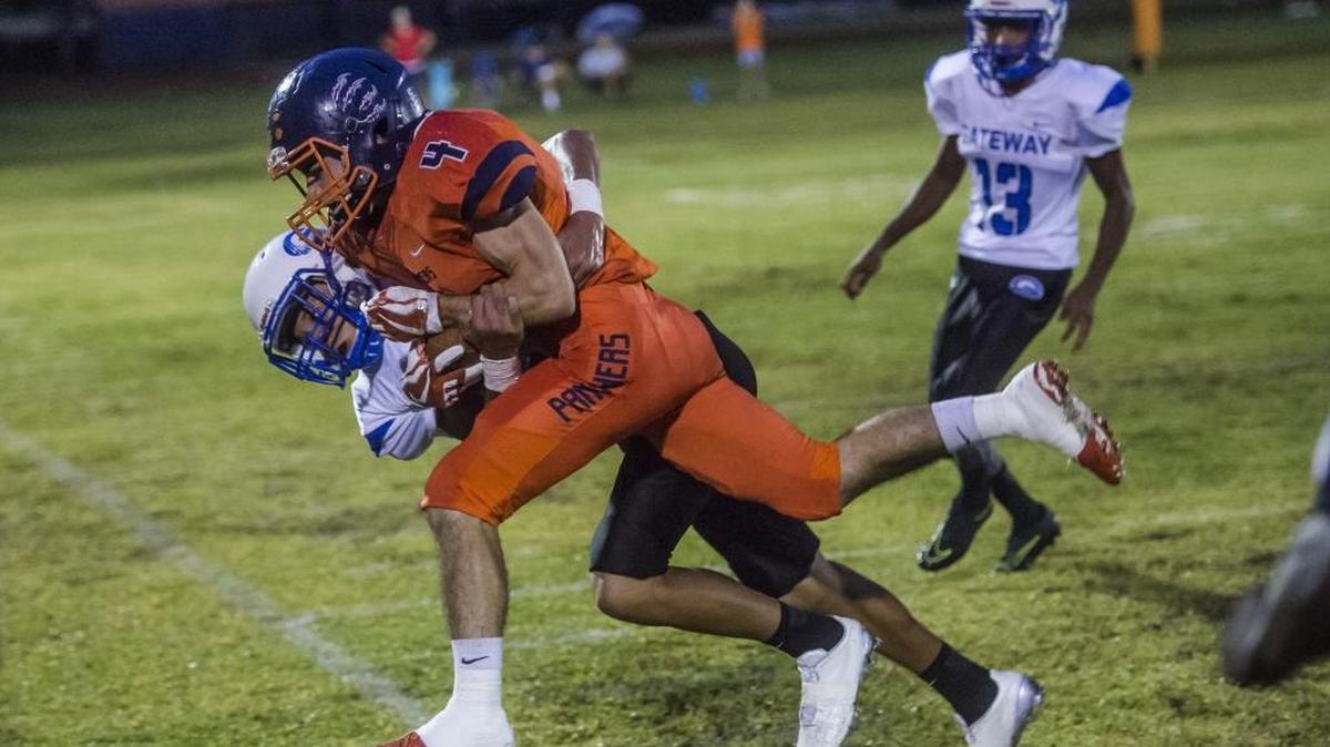 Bradenton Christian’s Travis Windham powers through defenders during Friday’s game against visiting Gateway Charter School.