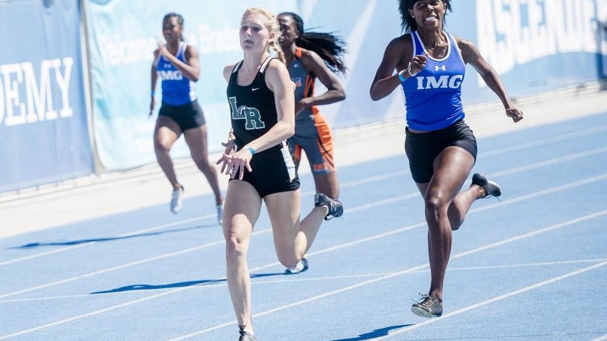 Lakewood Ranch’s Sophia Falco breaks ahead of the pack to win a girls 200-meters heat at IMG Academy earlier this season. Falco won the 100, long jump and triple jump at Saturday’s pre-state meet at IMG Academy.