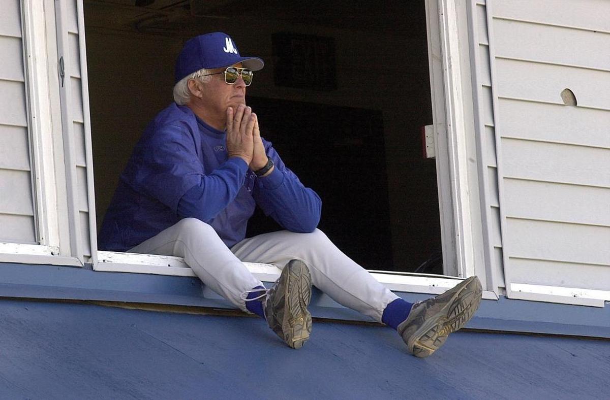 Coach Tim Hill, Sr., watches his team from the press box during Manatee Community College’s baseball practice in 2002.