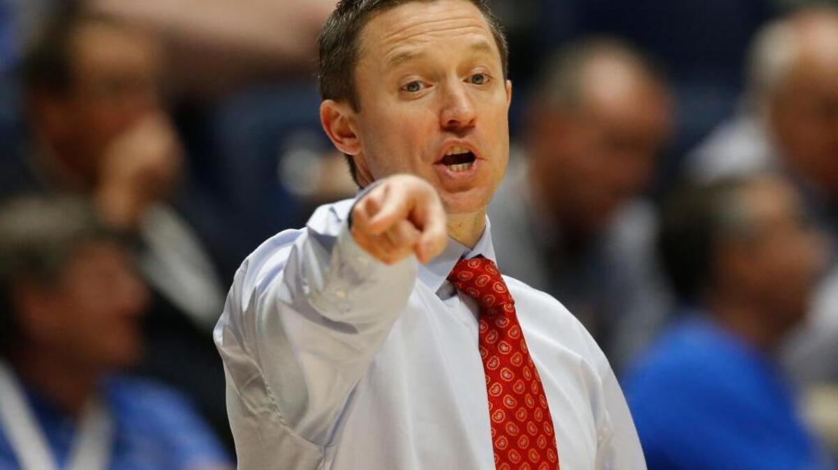In this March 11, 2016 photo, Florida head coach Mike White directs his team against Texas A&M during the second half of an SEC tournament game in Nashville, Tenn. A good chunk of White’s second season will be spent on the road.