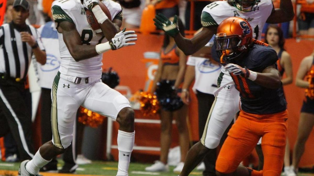 USF’s Rodney Adams runs into the end zone for one of his three touchdowns in Saturday’s win at Syracuse.