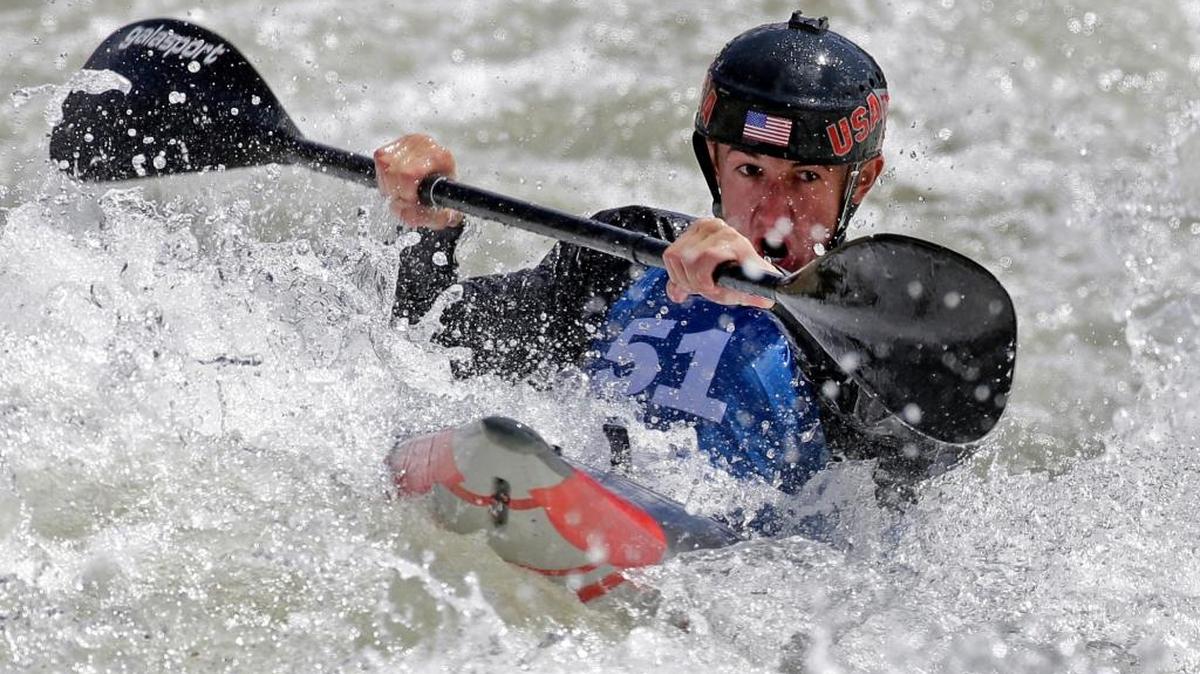 In this April 8, 2016, file photo, Michal Smolen paddles toward the finish line during the first day of the 2016 Slalom Olympic Team Trials for canoe and kayak in Charlotte, N.C. Smolen, who emigrated from Poland as a child, was unable to compete at the 2012 London Games due to questions about his citizenship, but should make a strong run to the podium this time around.
