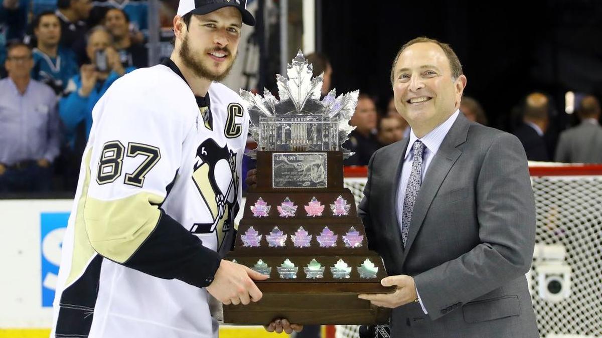 Pittsburgh center Sidney Crosby poses for photos with commissioner Gary Bettman as he accepts the Conn Smythe Trophy after Game 6 of the Stanley Cup Finals between San Jose and the Penguins Sunday in San Jose, Calif.