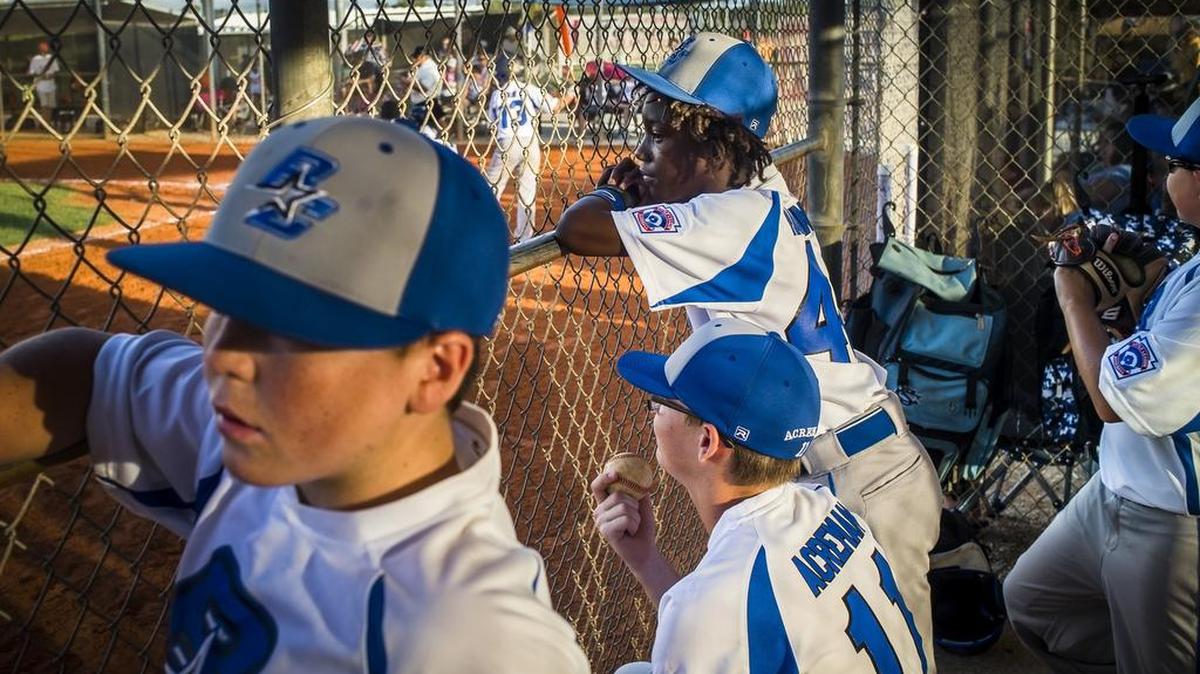 Players from Buffalo Creek watch from the dugout as their team handily defeats Lakewood Ranch during Little League District 26 All-Star Tournament on Tuesday at Buffalo Creek Park in Palmetto. Buffalo Creek beat Lakewood Ranch again Saturday to win the district title. 