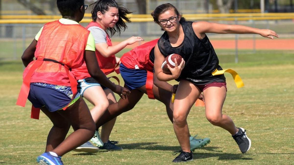 Halley Lawrence runs the ball during a scrimmage in flag football practice Friday at Palmetto High School.