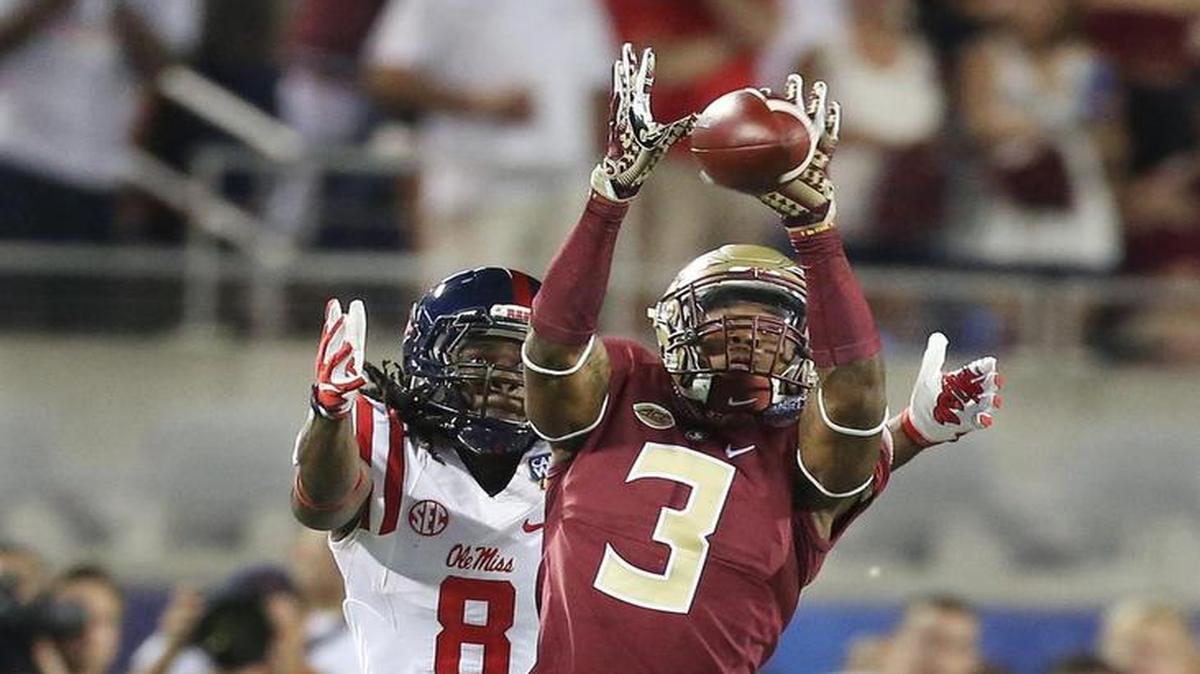 FSU defensive back Derwin James (3) intercepts a pass intended for Ole Miss receiver Quincy Adeboyejo (8) during the Florida State versus University of Mississippi college football game at Camping World Stadium in Orlando on Monday, September 5, 2016.