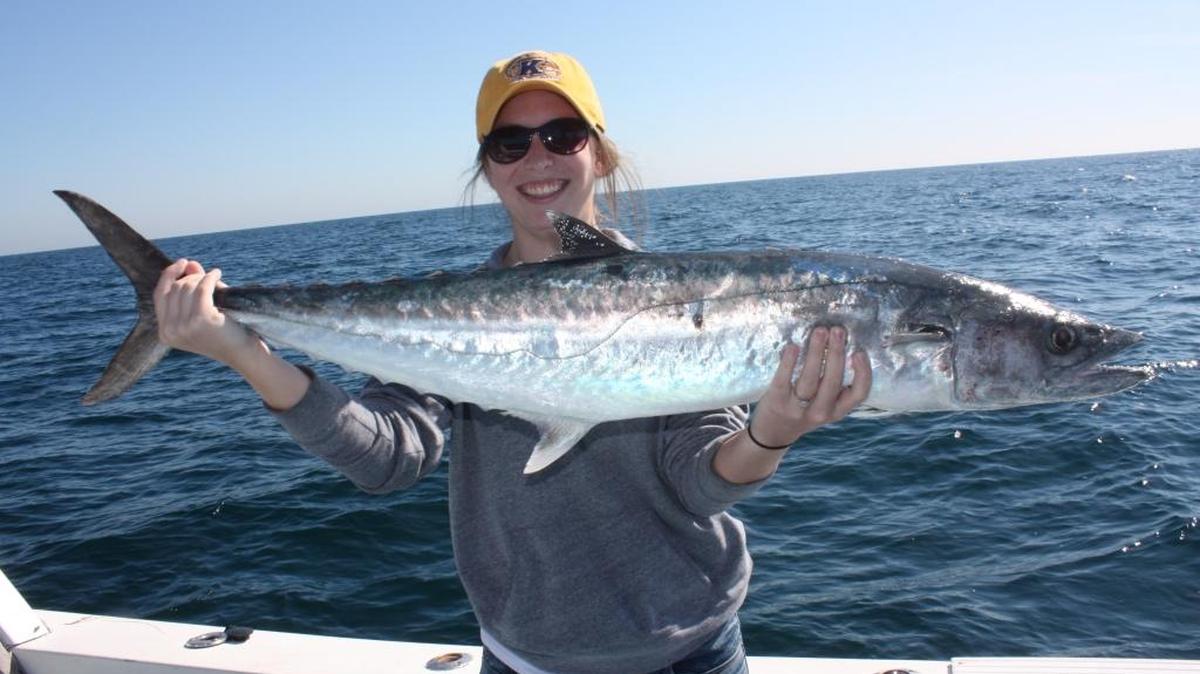 Tanner Owens, of Delray, Ohio, holds the smoker king she caught using a sardine in about 45 feet of water while fishing with Capt. Larry McGuire in the Gulf of Mexico on Dec. 22. Kings were biting aggressively as were grouper and snapper.