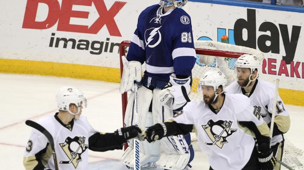 Tampa Bay goalie Andrei Vasilevsky looks up as Pittsburgh defensemen Kris Letang and Olli Maatta congratulate each other during the third period of Game 6 of the NHL Eastern Conference finals Tuesday in Tampa.