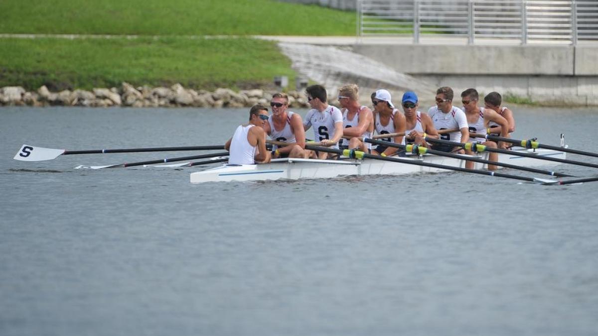 The team of Jacob Shusko, Andrew O’Grady, Harrison Schofield, Jeremy Lipford, Christian Irving, C. Shaw Bowman, Clark Dean, Travis Earp and Cian Graue rest after crossing the finish line after placing third in the men’s eight team with the time of 5:24.254.