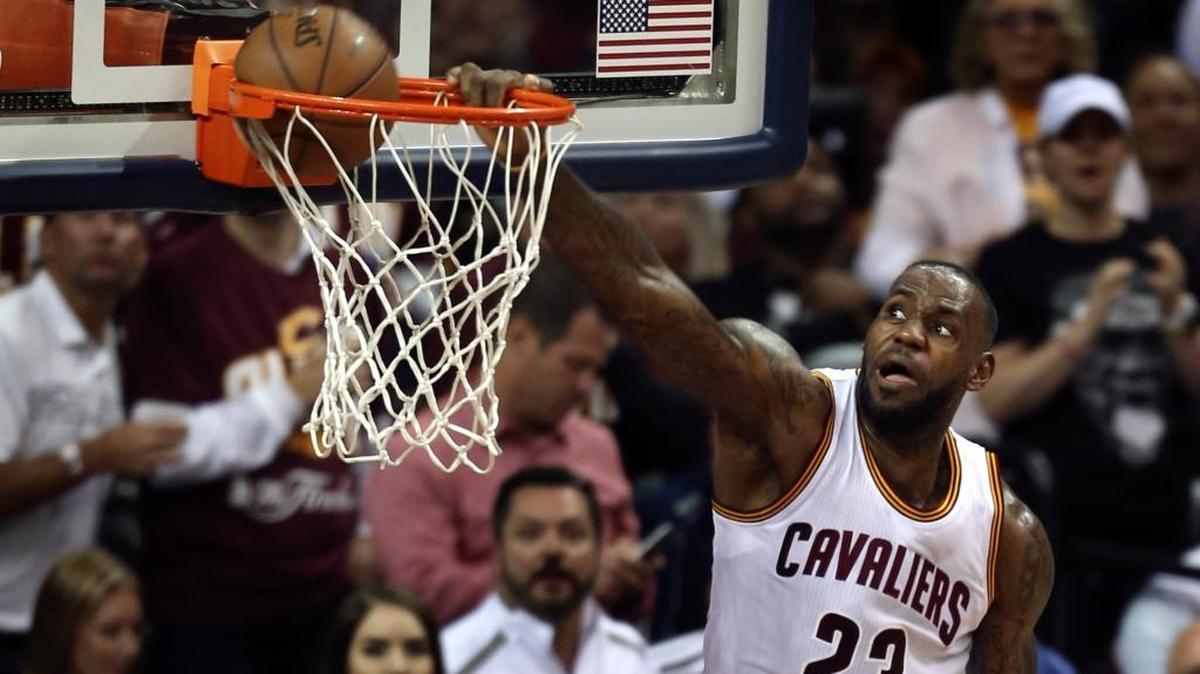 Cleveland forward LeBron James (23) dunks against Golden State during the second half of Game 3 of the NBA Finals in Cleveland, Wednesday.