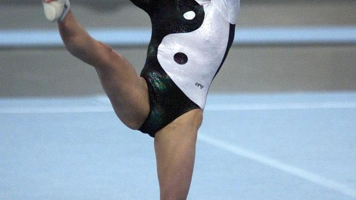 In this Nov. 24, 2001 file photo, Oksana Chusovitina, then competing for Uzbekistan, performs as she wins the floor competition during the international gymnastics tournament DTB Pokal in the Hanns-Martin-Schleyer indoor arena in Stuttgart, southern Germany. Chusovitina who holds German citizenship now will compete at her seventh Olympics when she goes to Rio de Janeiro, becoming the oldest Olympic female gymnast in history at age 41.