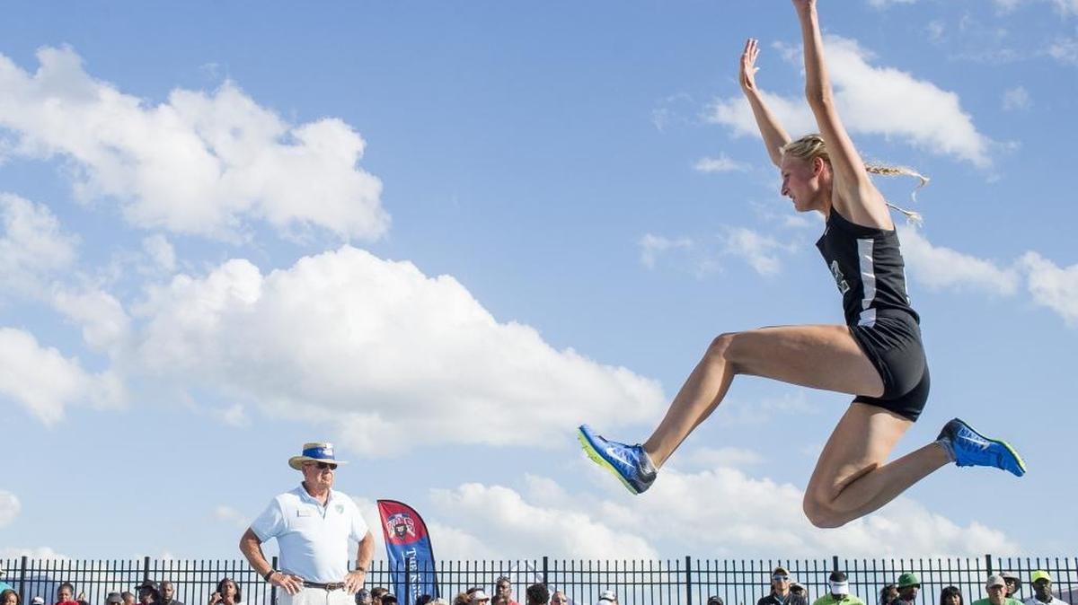 Lakewood Ranch’s Sophia Falco soars during the long jump competition during the first day of the FHSAA State Track and Field finals on Friday at IMG Academy in Bradenton. Falco, who is bidding for gold in four events this weekend, won the event.