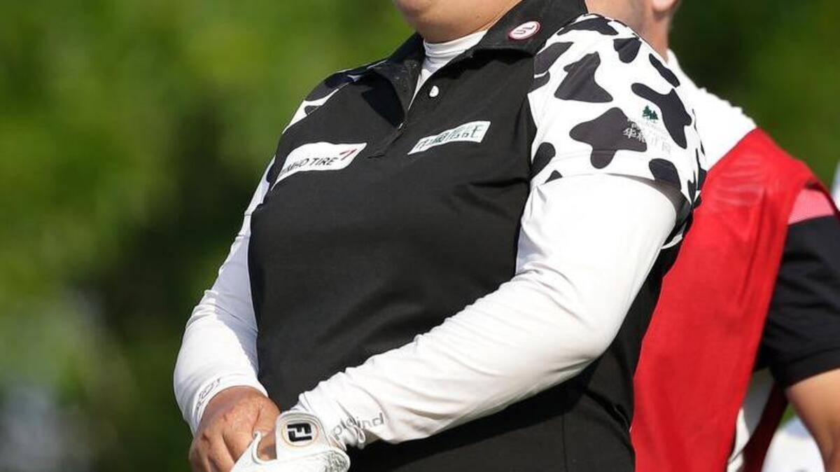 China’s Shanshan Feng lines up her shot on the 13th tee during the first round of the U.S. Women’s Open on Thursday in Bedminster, N.J.
