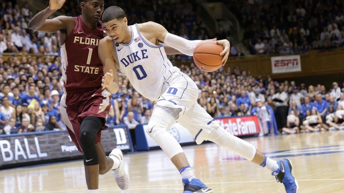 Duke’s Jayson Tatum drives to the basket while Florida State’s Jonathan Isaac defends during the second half of the teams’ game in Durham, N.C., on Feb. 28. Both teams are in the NCAA Tournament field.