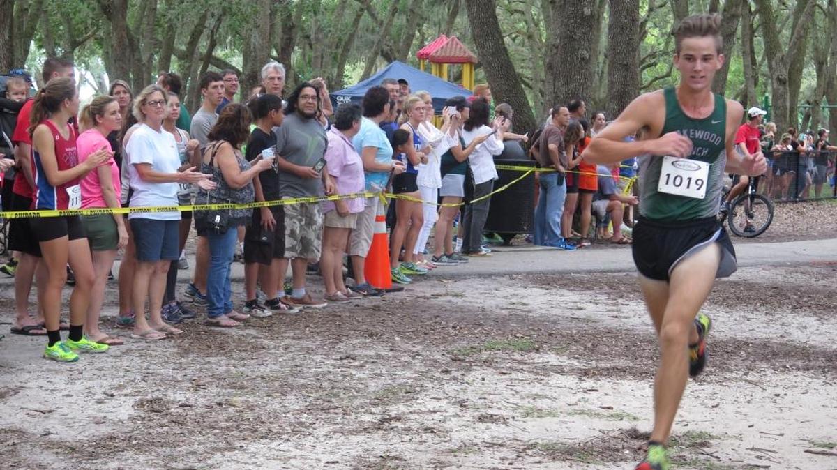 Lakewood Ranch’s Andrew Dean crosses the finish line to finish sixth at the Tri-County Championship on Saturday at G.T. Bray Park.
