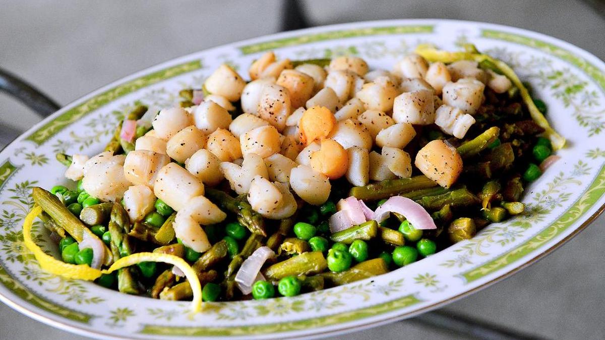 You can now catch your own bay scallops, shown flash cooked and served with shallots, peas, asparagus and a white wine-lemony sauce, north of the Pasco/Hernando county line. Bay scallop season opened in the Gulf of Mexico state waters on Saturday. 
