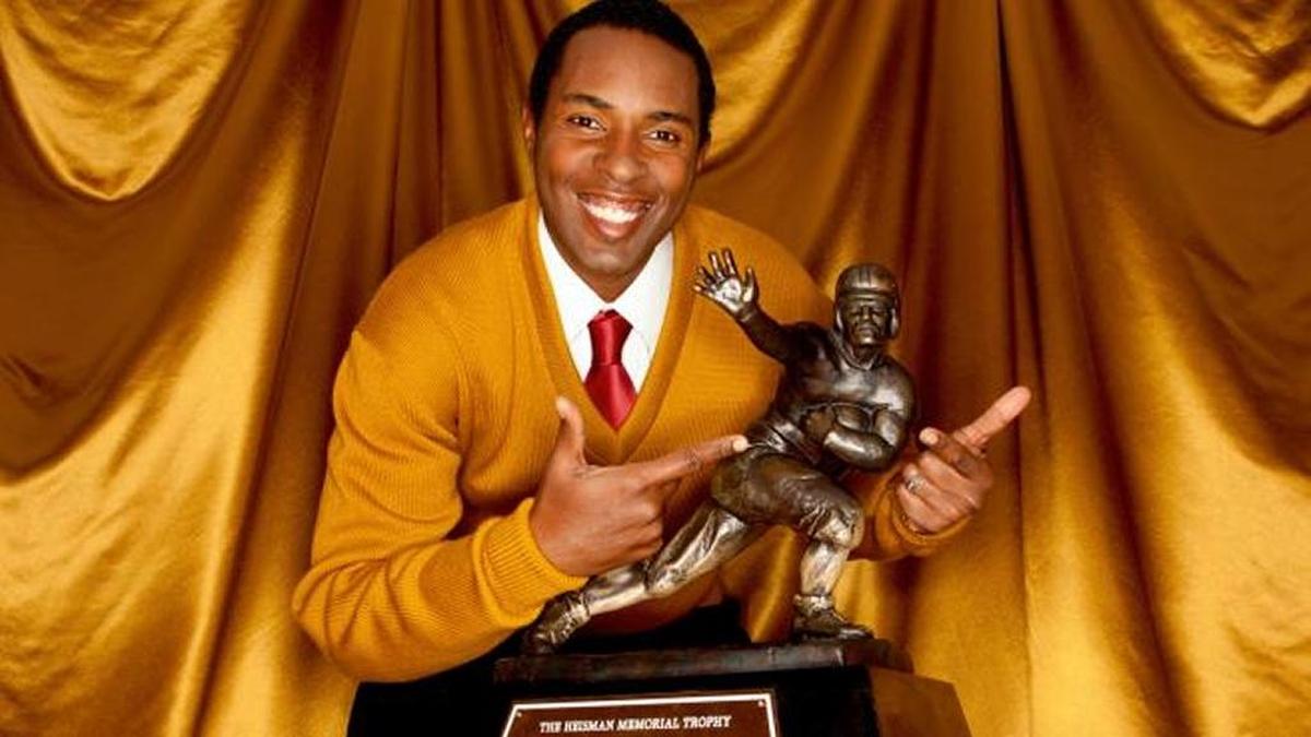 Charlie Ward poses with the Heisman Trophy, which he won in 1993.