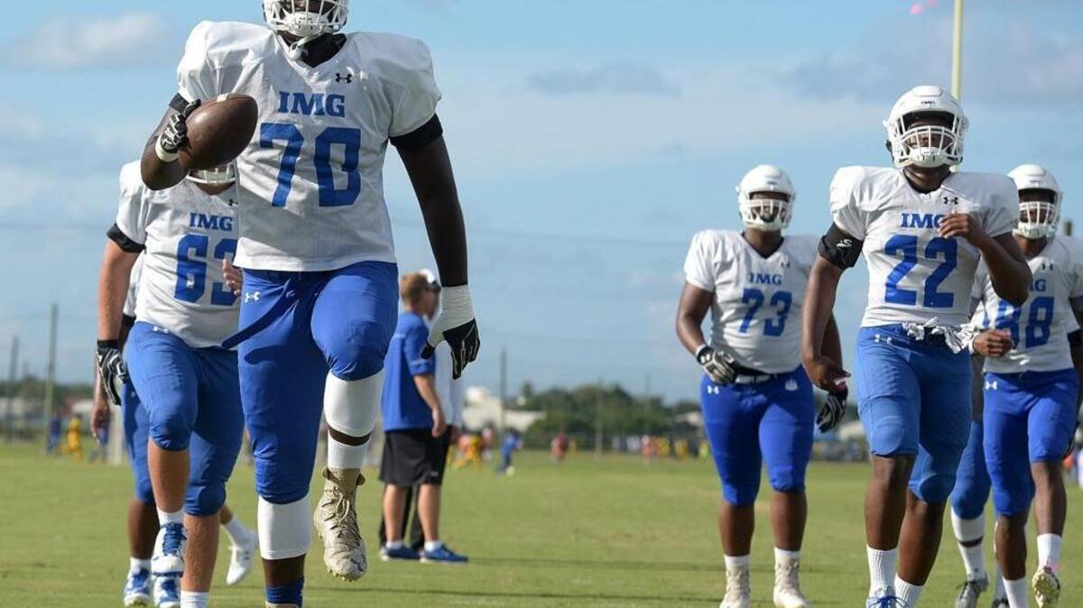 IMG Ascenders offensive lineman Reuben Unije leads the way in drills.