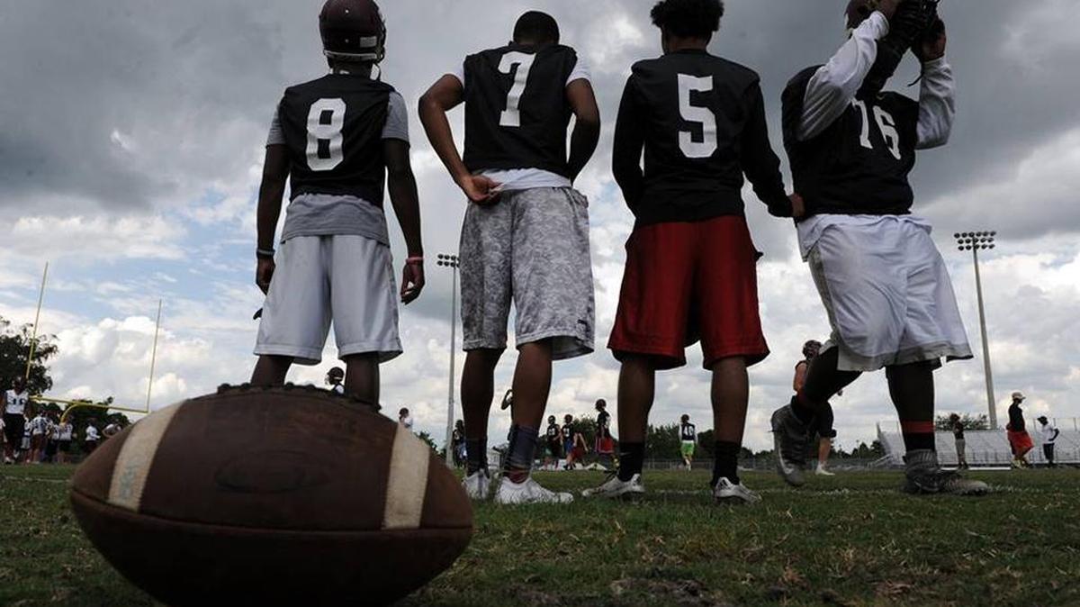 Braden River players wait along the sidelines for their turn on the field during spring football practice April 25 in Bradenton.