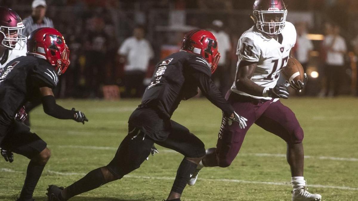 Braden River’s Knowledge McDaniel attempts to juke Palmetto defenders during Friday’s game at Palmetto.