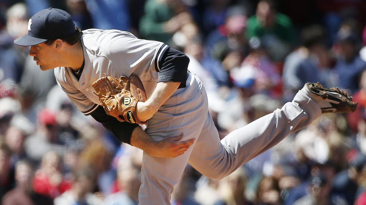 Starting pitcher Nathan Eovaldi delivers during the first inning for the New York Yankeees against Boston in 2015. The Rays are close to signing the free agent who will miss this season as he recuperates from his second Tommy John surgery.