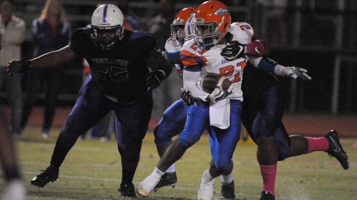 Southeast running back Latrell Peavy runs through the Sarasota Booker defense.