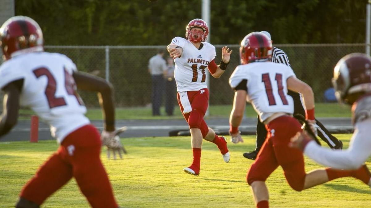 Palmetto quarterback Anthony Marino, shown against Sarasota Riverview earlier this season, threw for 196 yards and three touchdowns to lead the Tigers past Sarasota on Thursday night.