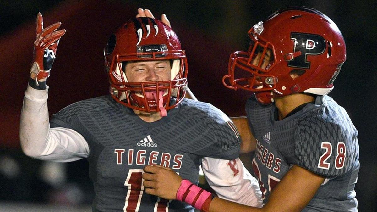 Palmetto’s Derek Marino celebrates a touchdown with Kobe Mays during Palmetto’s homecoming game against Lakewood Ranch on Friday night.