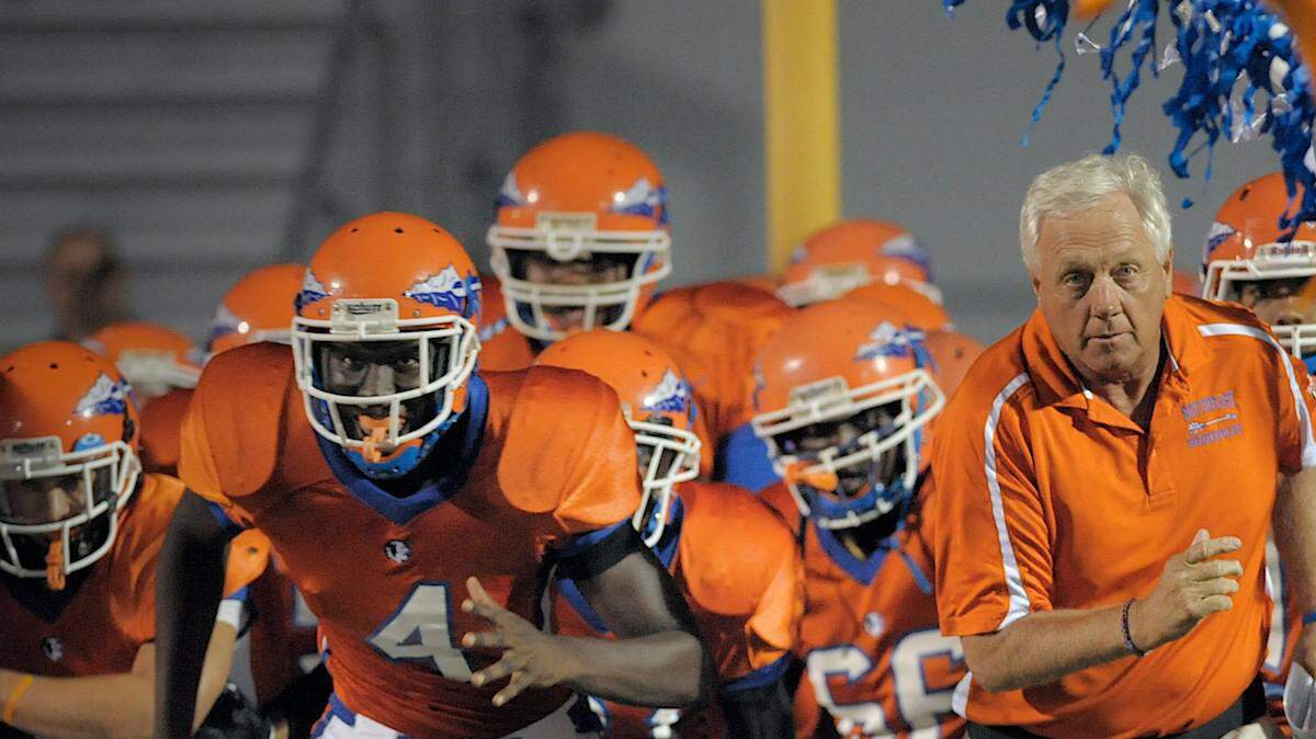 Paul Maechtle leads the Southeast Seminoles onto the field.