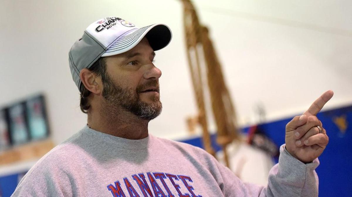 Manatee wrestling coach Andrew Gugliemini has recorded his 500th dual meet victory.