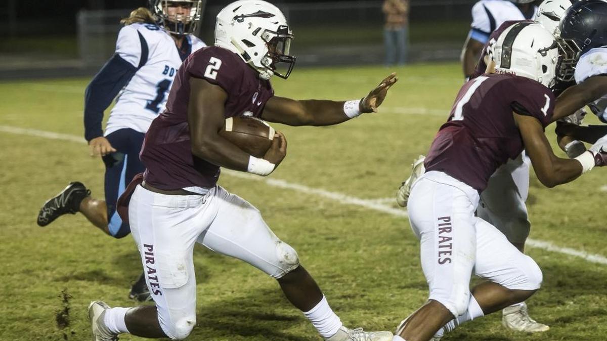 Braden River’s Deshaun Fenwick rushes through North Port defenders on Thursday. Fenwick ran for 217 yards and two touchdowns on 18 carries.