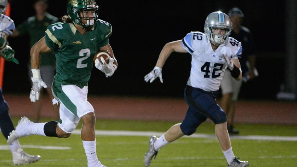 Chase Brown runs 75 yards for a touchdown in the first quarter Friday in a SSAC playoff game against Out-of-Door Academy.