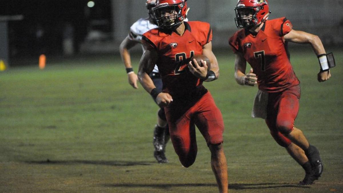 Cardinal Mooney RB Bryce Williams (21) runs for yardage in the second quarter.