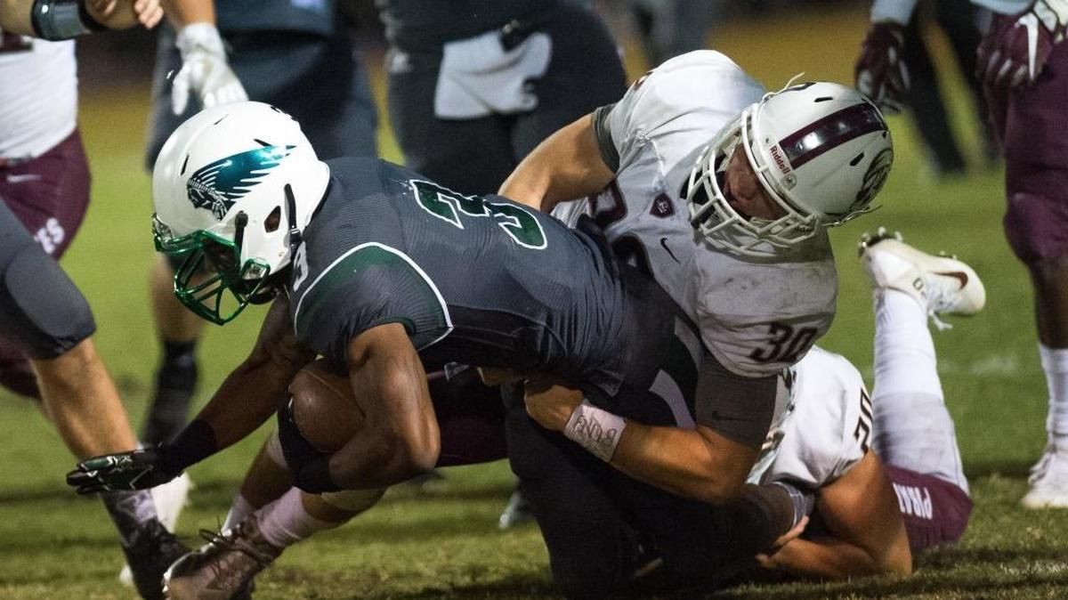 Braden River's Gavyn Purdy brings down Venice's Matt Laroche during Braden River High School's game at Venice High School on Friday night, October 14, 2016 in Venice.