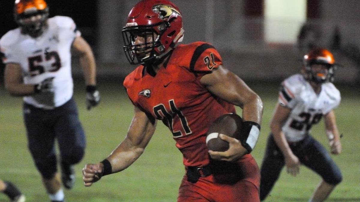 Cardinal Mooney RB Bryce Williams (21) runs in a 36-yard touchdown to tie the game in the second quarter.