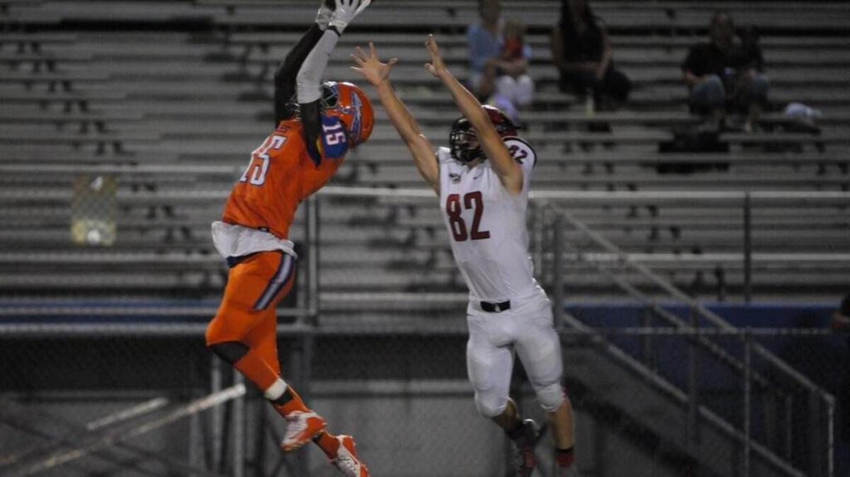 Southeast DB Damien Washington makes an interception in the second quarter of Friday’s win against Cardinal Mooney.
