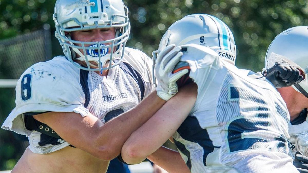 Ryan Ives runs drills as the Out-of-Door Academy football team practices Aug. 15.