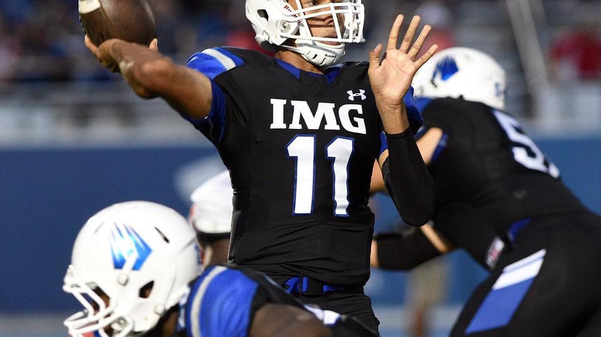 IMG's Kellen Mond look for a receiver during Saturday’s game. Mond finished with 191 yards on 9-of-13 passing and 81 yards on 12 carries.