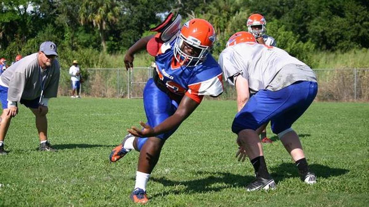 Southeast edge rusher Teriq Houston blows past a blocker during practice.