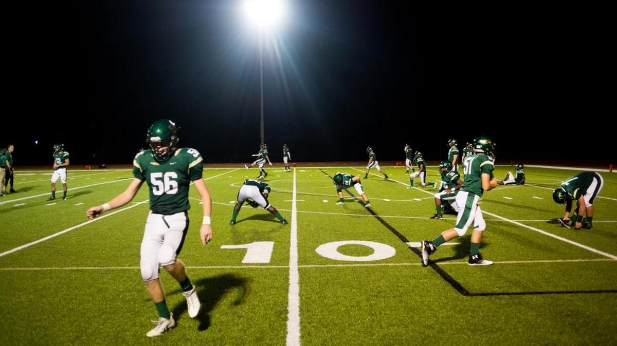 Saint Stephen’s Parker Lansberg warms up with his team after halftime as Saint Stephen’s plays host to Seffner Christian on Thursday in the regular-season finale. The Falcons open the playoffs at home on Friday.