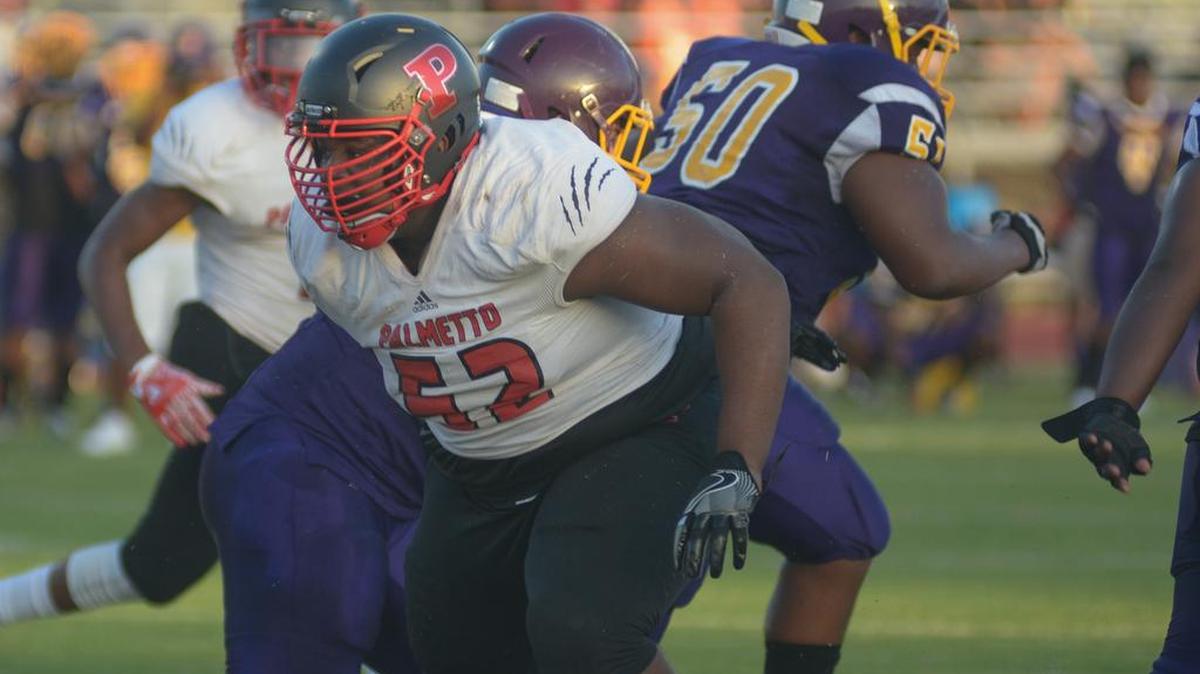 Defensive lineman Rodshon Williams breaks through the offensive line against Booker in Sarasota on Friday.