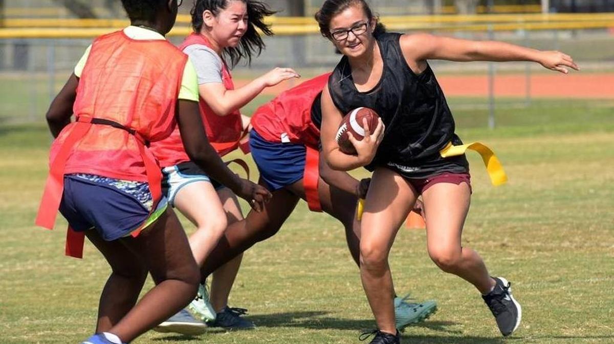 Halley Lawrence runs the ball during a scrimmage in flag football practice at Palmetto High School