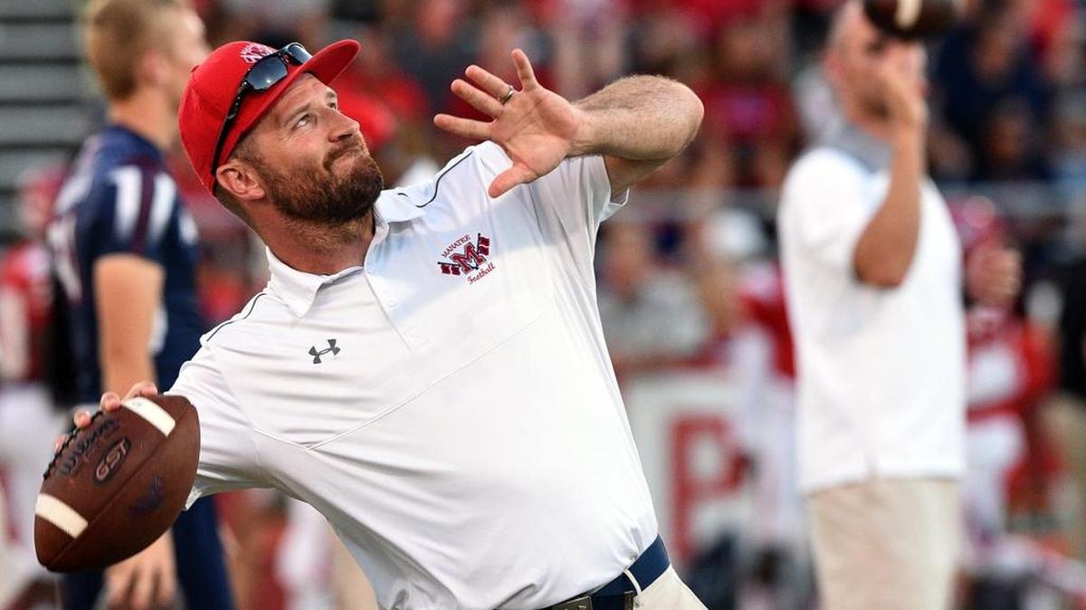 File: Assistant coach James Booth warms up the players at Manatee High's homecoming game against Steinbrenner High on Sept. 30, 2016 at Hawkins Stadium.