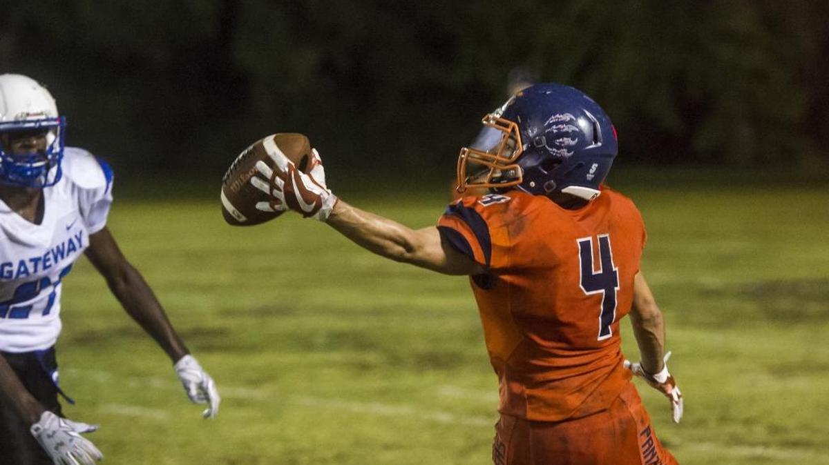 Bradenton Christian's Travis Windham turns to make a one-handed catch during Bradenton Christian's game against Gateway Charter School.