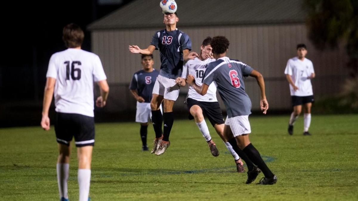 Palmetto’s Gilberto Caballero jumps for a header in the game against Lakewood Ranch High School on Jan. 6 at Lakewood Ranch.