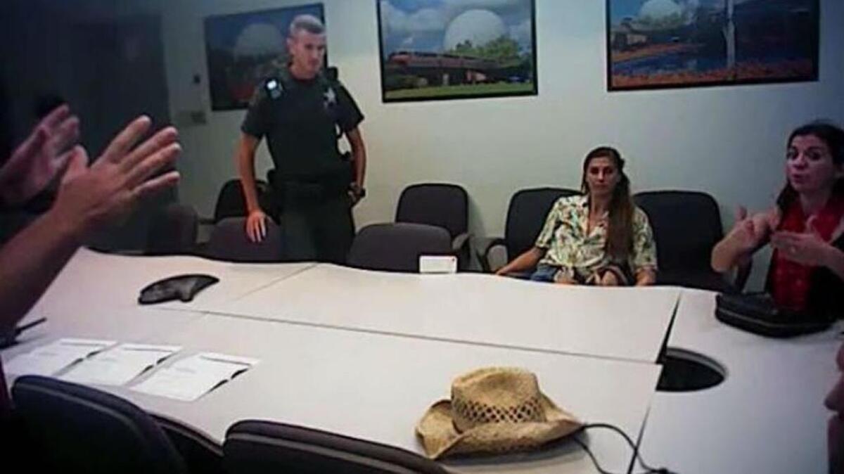 Video shows Alex Morgan, Giles Toia and his wife, Courtney Toia, in a room talking with deputies.
